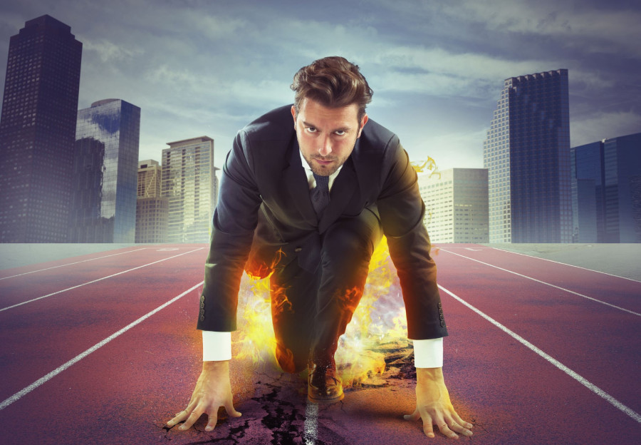 Man in suit preparing to run